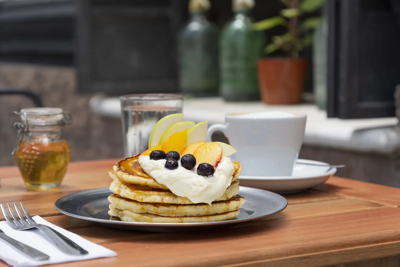 Pancakes and coffee on a cafe table. The photo was not taken at a Clermont restaurant.