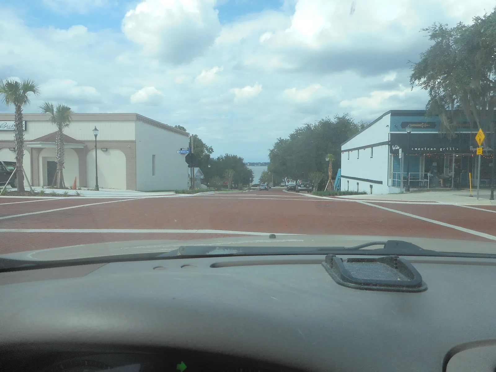 Eighth Street at Minneola Avenue in downtown Clermont, with Lake Minneola at the end of the street.