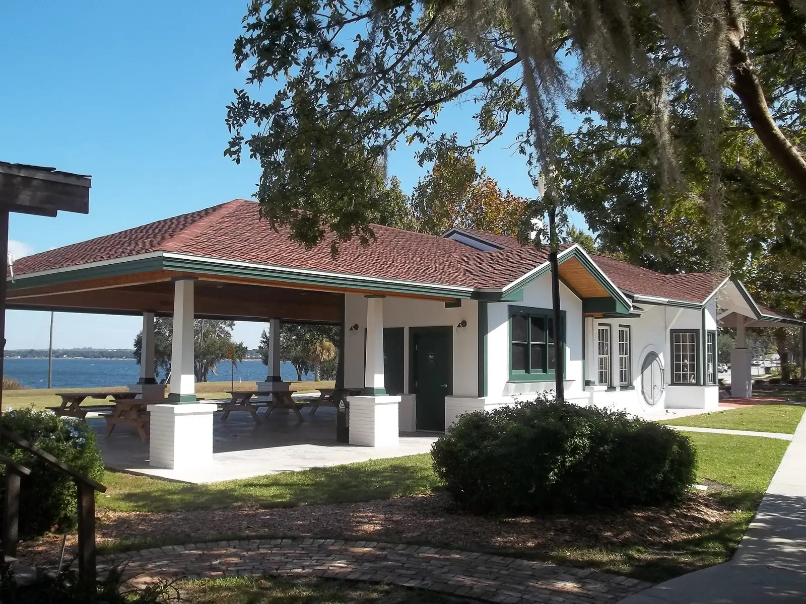 The renovated railroad depot at the Clermont Historic Village, with Lake Minneola behind it.