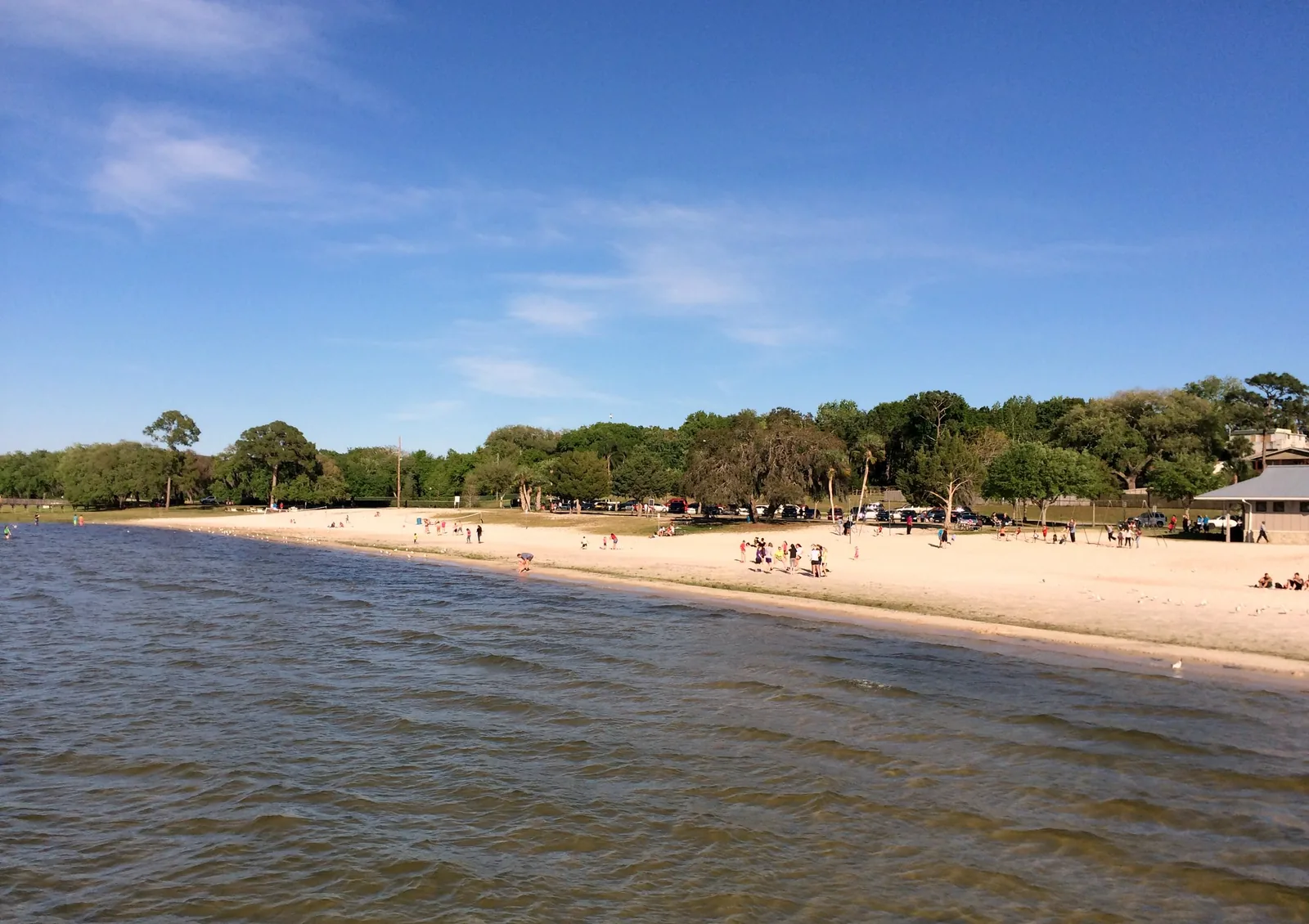 The beach at Waterfront Park on Lake Minneola in Clermont, seen from the pier.
