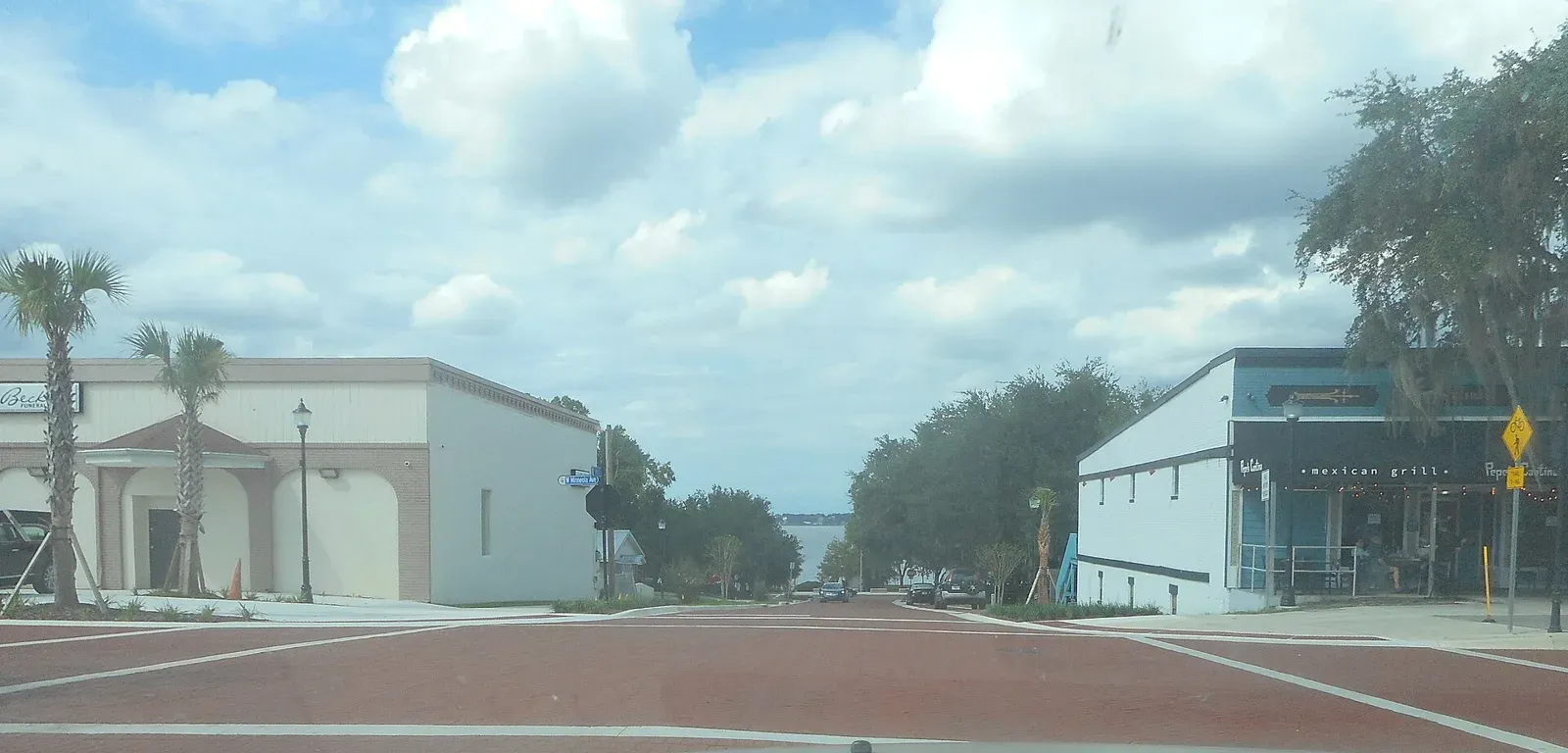 Eighth Street at Minneola Avenue in downtown Clermont, with Lake Minneola at the end of the street.